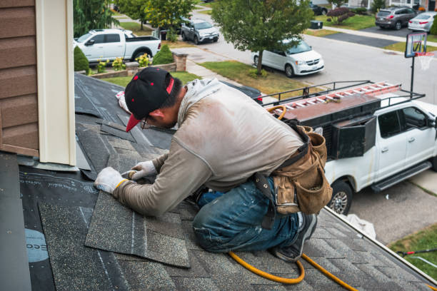 Professional Roofing technician working in South Barre, VT